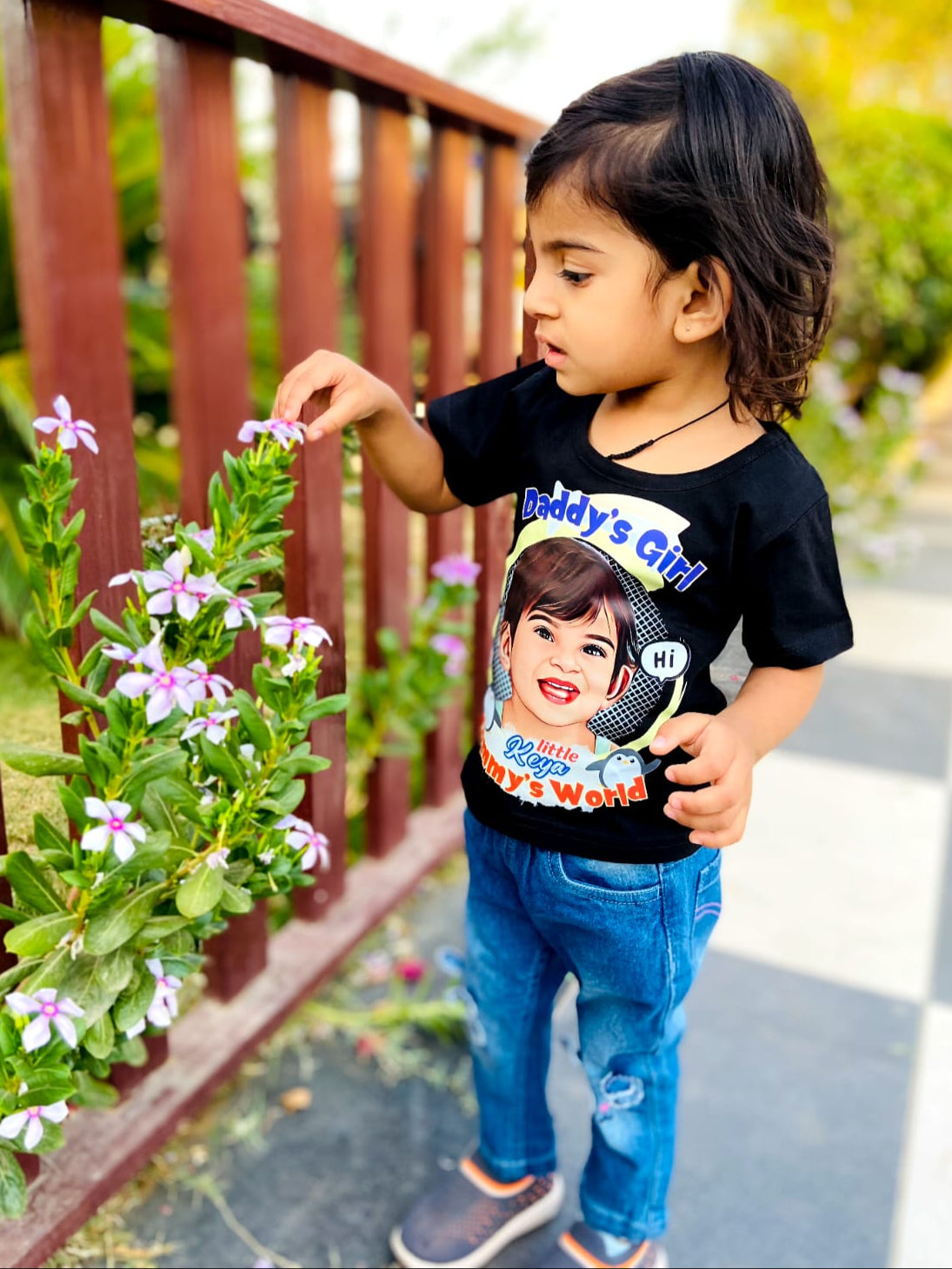 Toddler girl wearing black Daddy’s Girl custom t-shirt with photo and name print