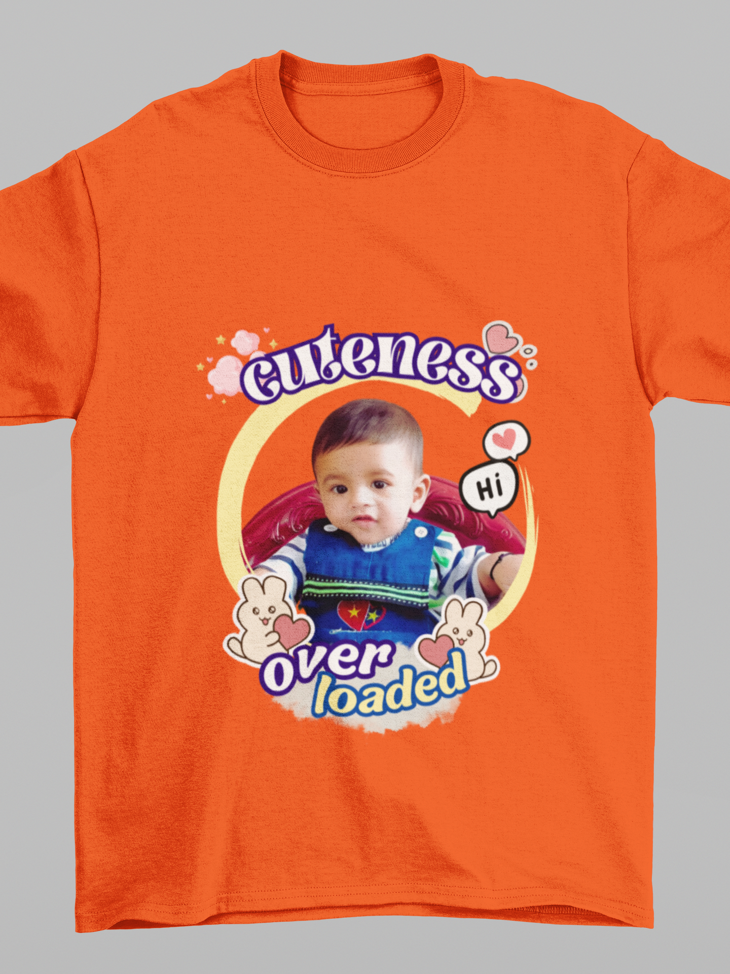 An orange customized T-shirt with a photo of a child and the text 'cuteness over loaded' printed on it.