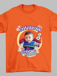 An orange customized T-shirt with a photo of a child and the text 'cuteness over loaded' printed on it.